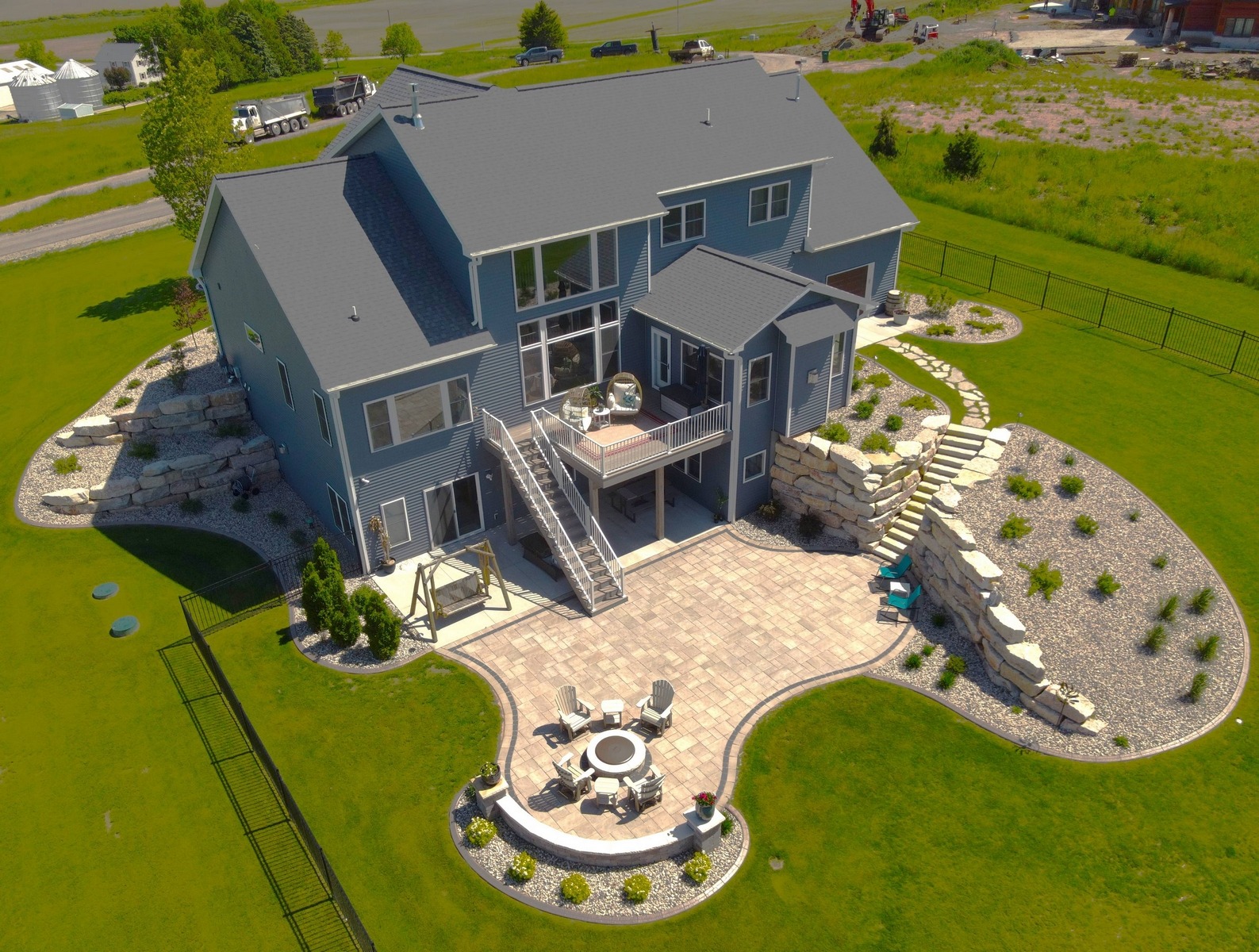 Aerial view of modern home with landscaped backyard