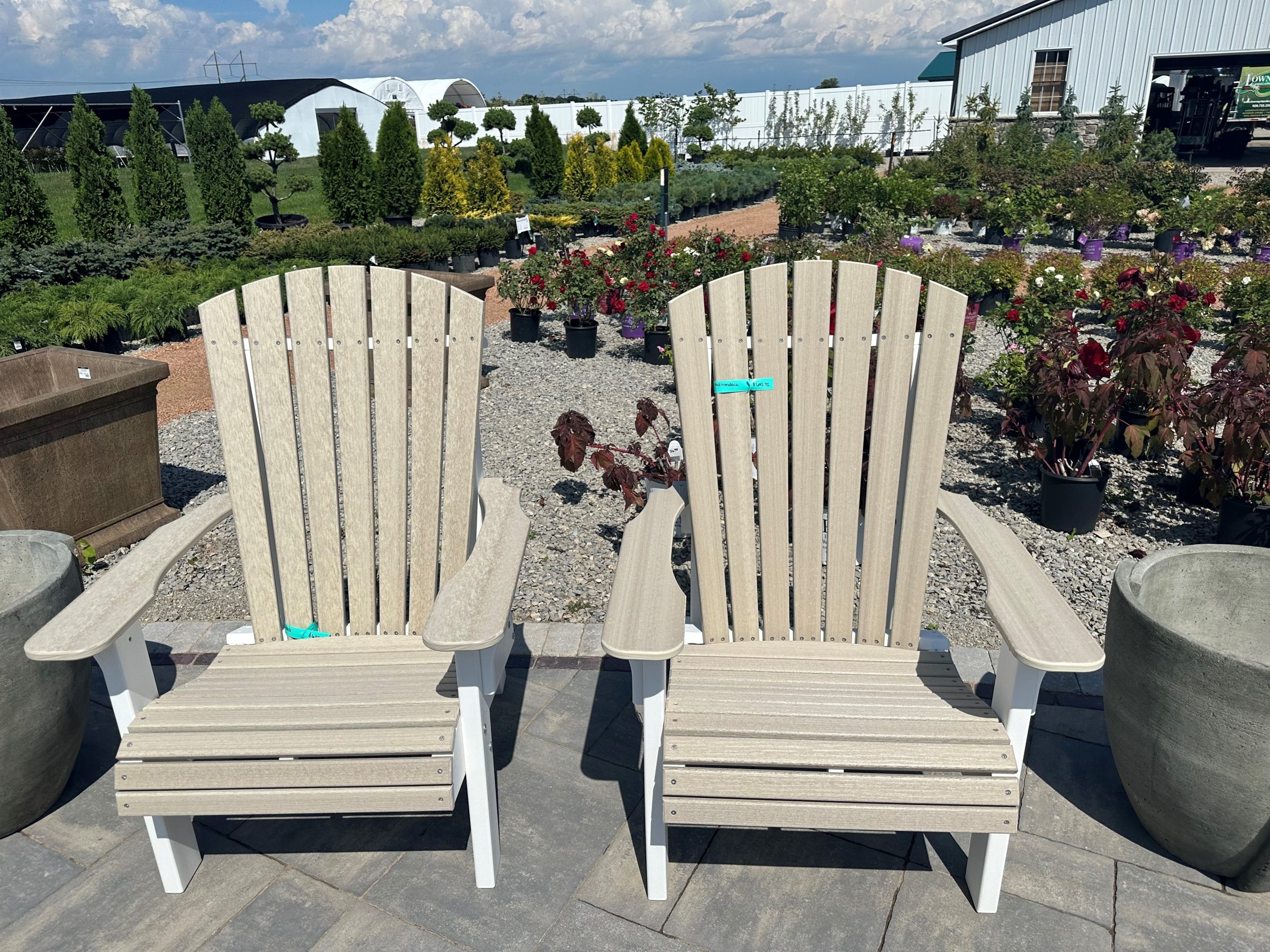 Two Adirondack chairs at outdoor garden center