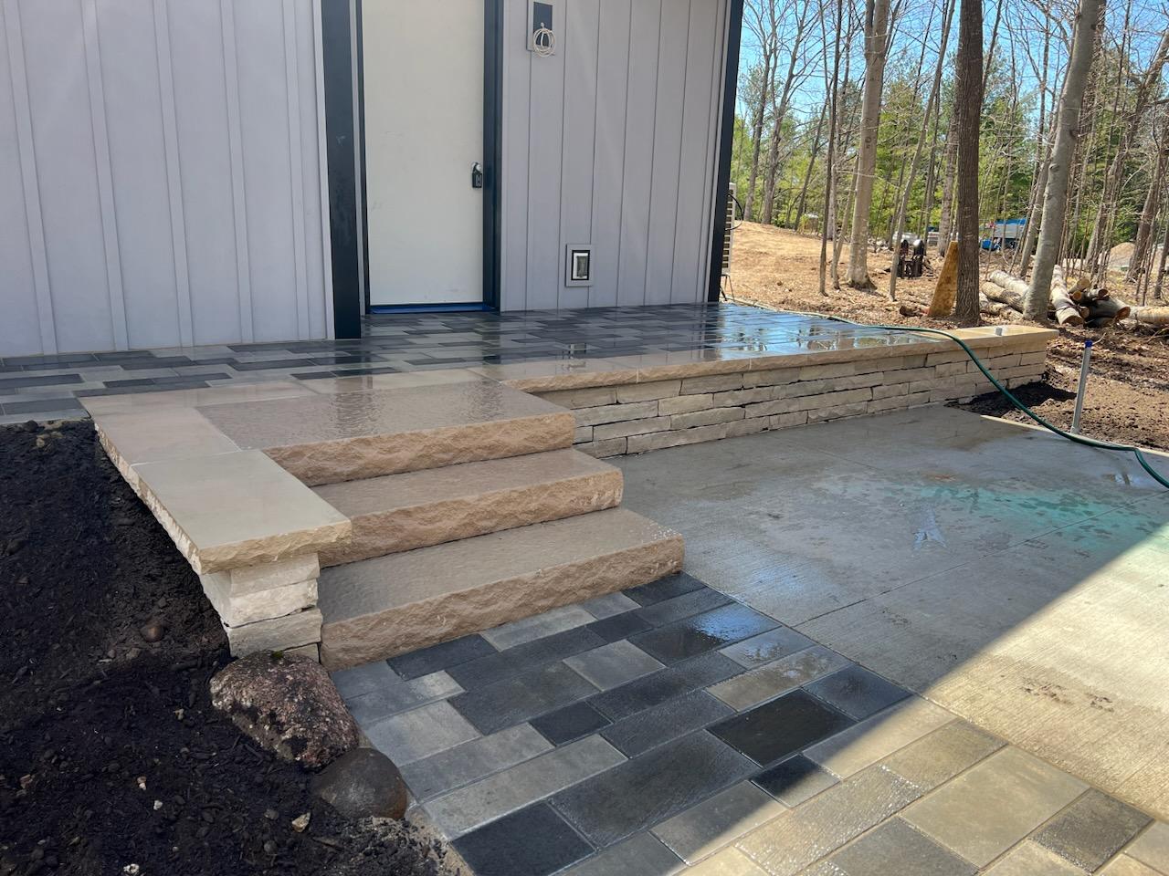 Modern stone steps and paver front porch