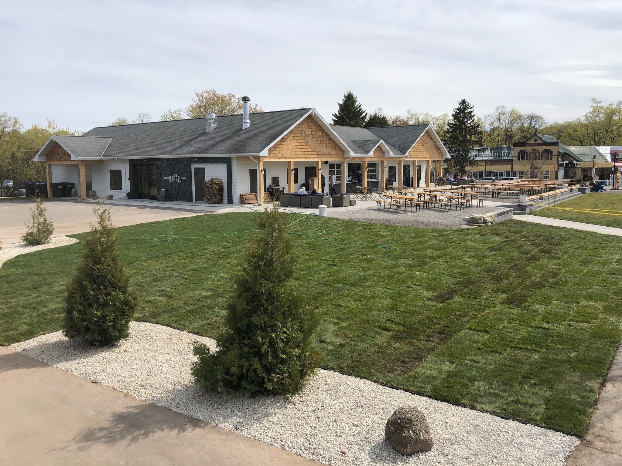 Modern brewery with outdoor patio and picnic tables