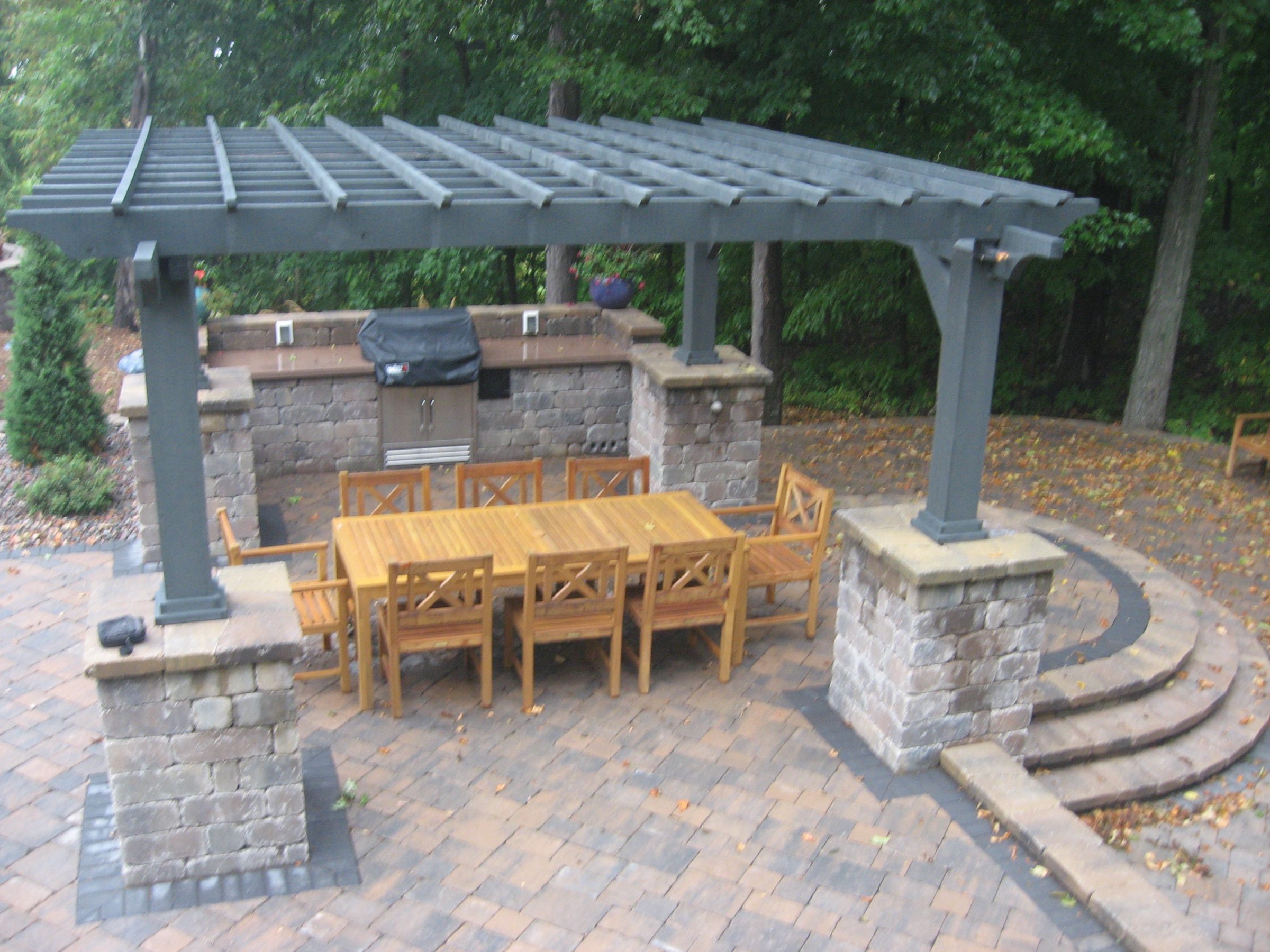 Backyard patio with pergola and outdoor dining set