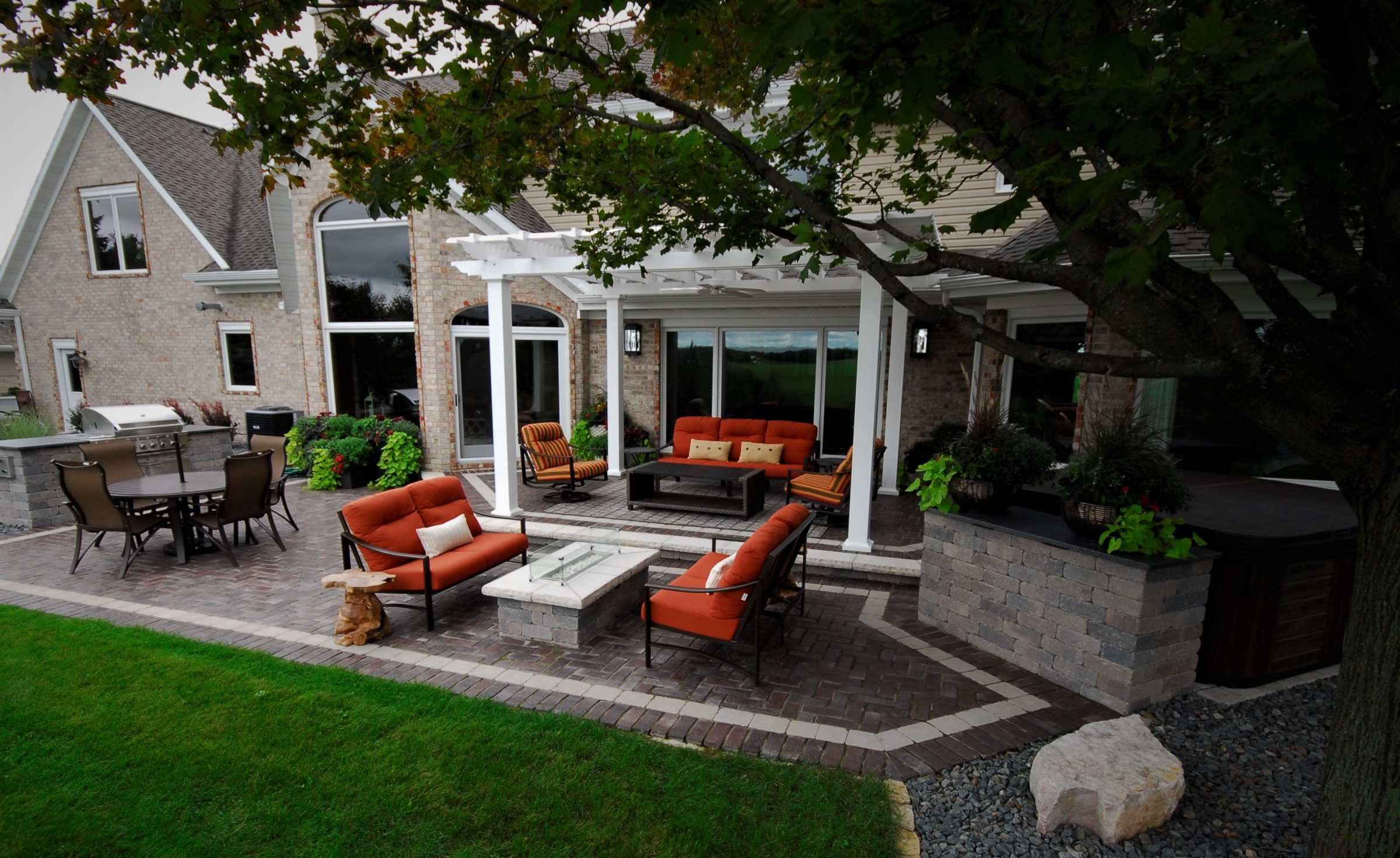 Spacious backyard patio with pergola and seating
