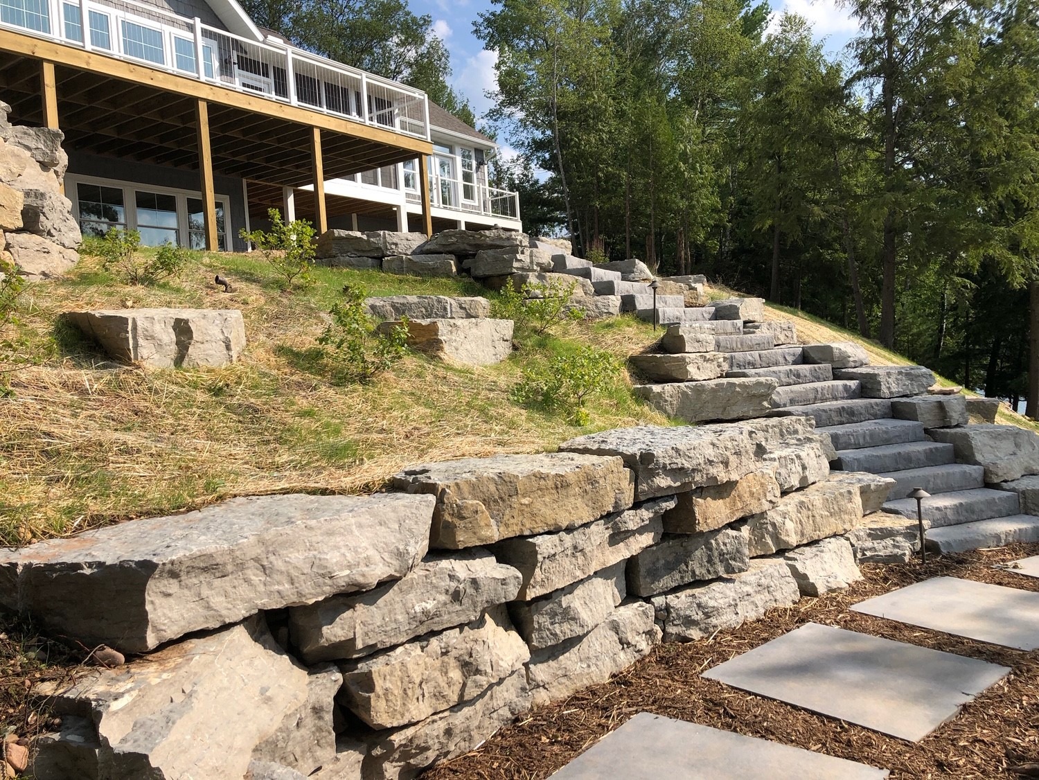 Stone retaining wall and steps on hillside