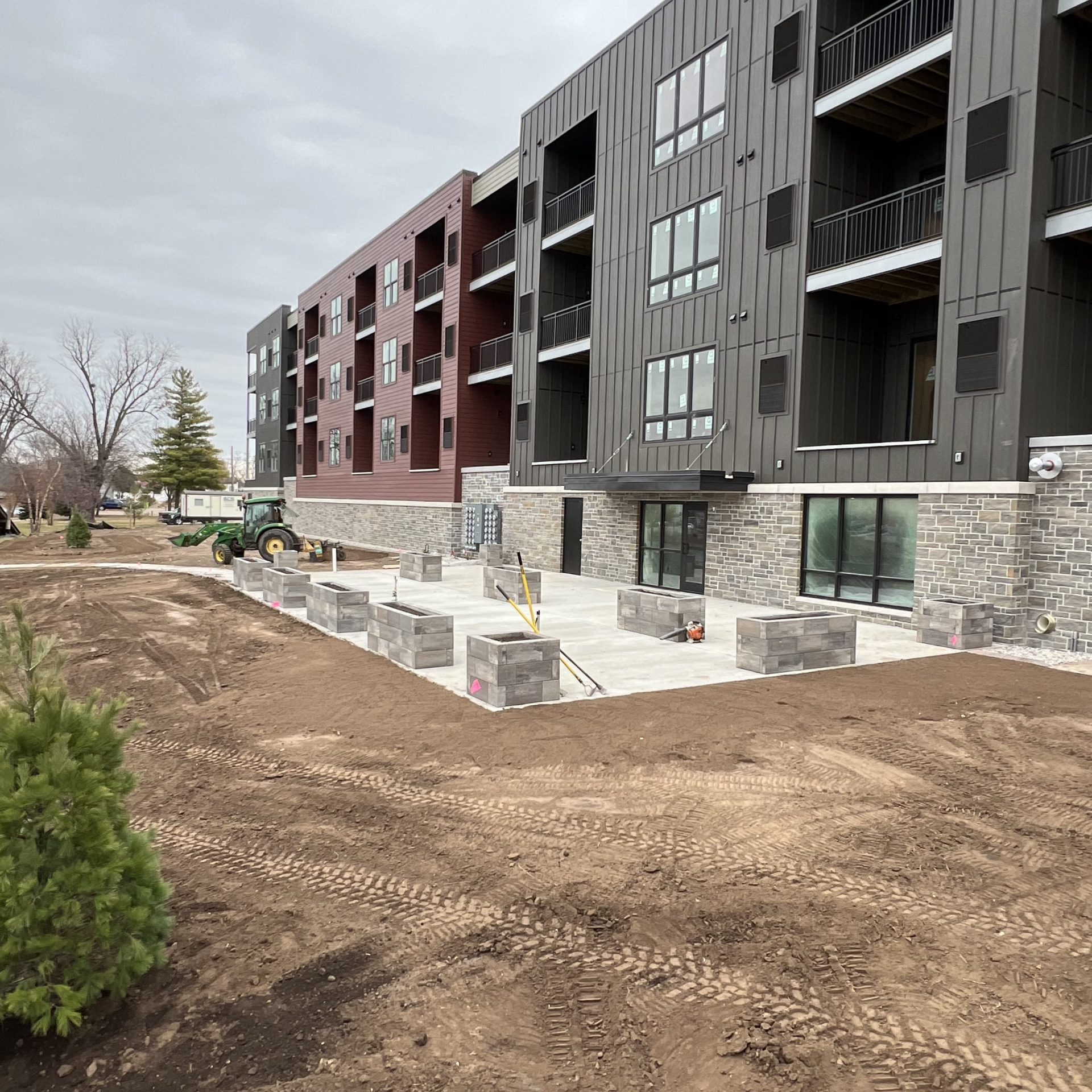 New apartment building under construction with landscaping work