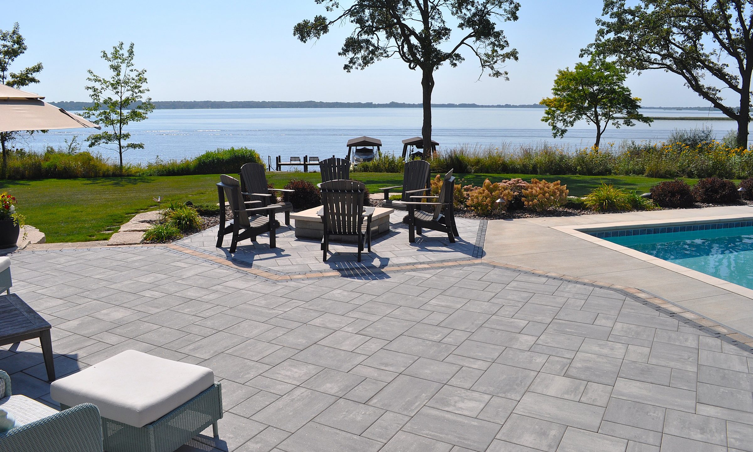 Lakeside patio with fire pit and pool