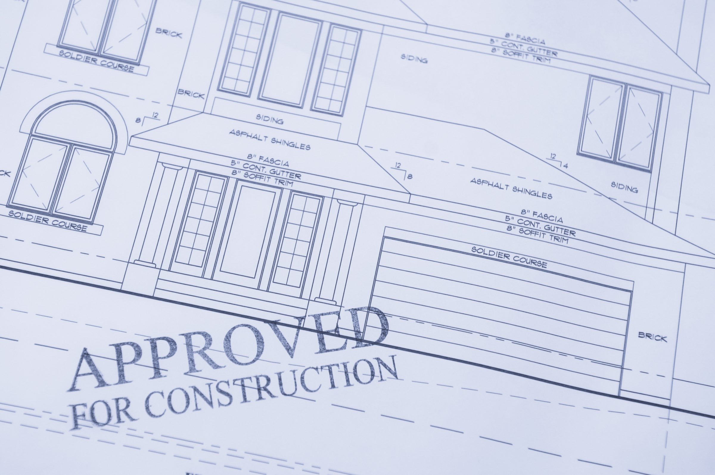 Approved residential house blueprint with construction stamp