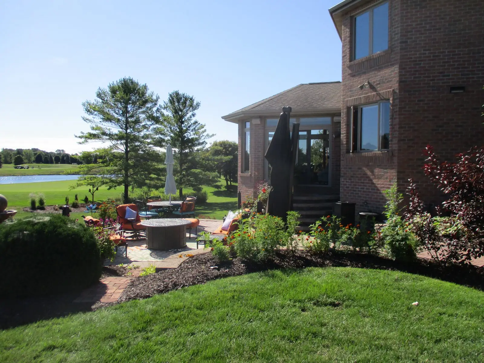 Backyard patio overlooking golf course and pond