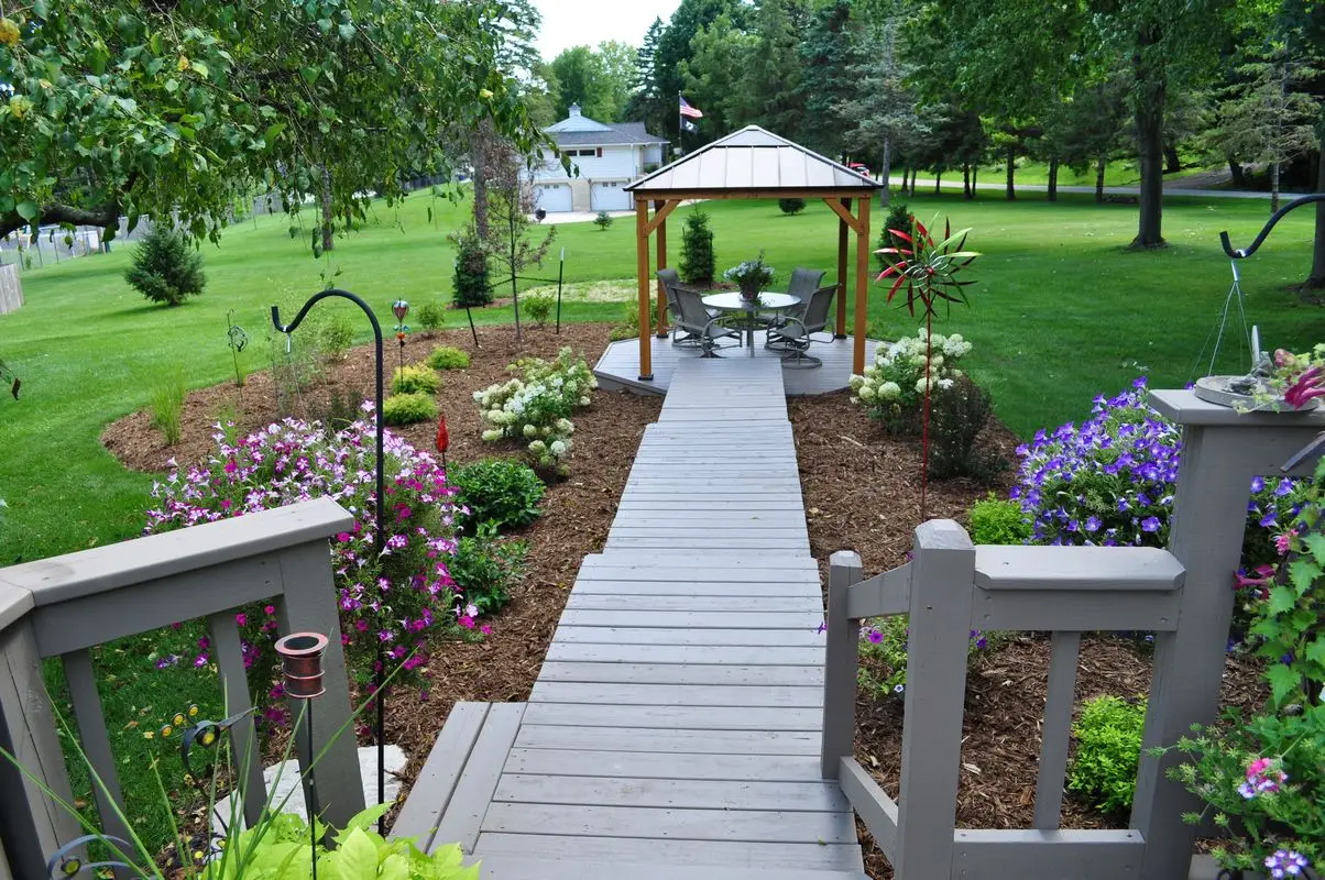 Garden walkway leading to backyard gazebo